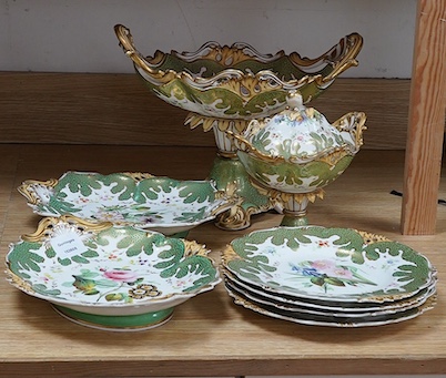 A circa 1835 part dessert set of floral and gilt decorated Rockingham style china, pattern number 6626, centrepiece 34cm wide. Condition - small comport cover cracked badly, some wear to gilding and pattern on plates